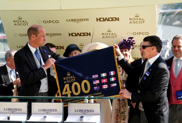 The Prince of Wales presents Aidan O'Brien with a memento marking his 400th top-level winner