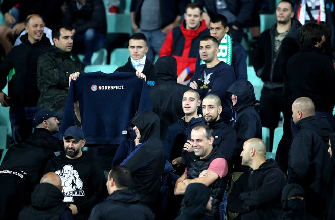 A Bulgaria fan holds up a 'No respect' slogan