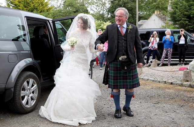 Rose Leslie and her father Sebastian Leslie arrive at the church for the wedding (Jane Barlow/PA)