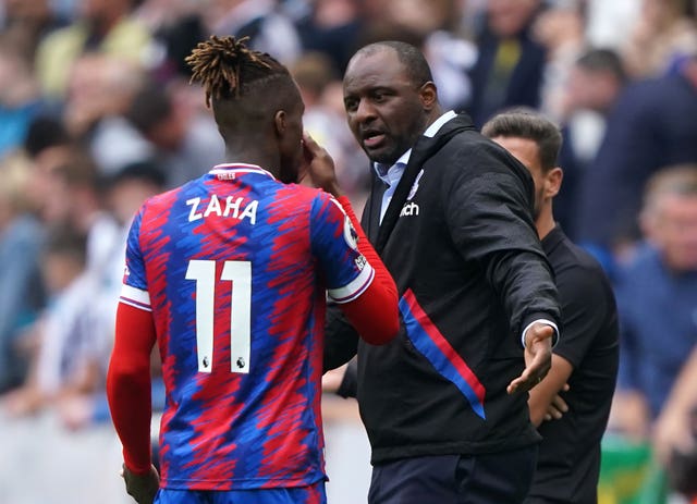 Crystal Palace manager Patrick Vieira (right) with Wilfried Zaha