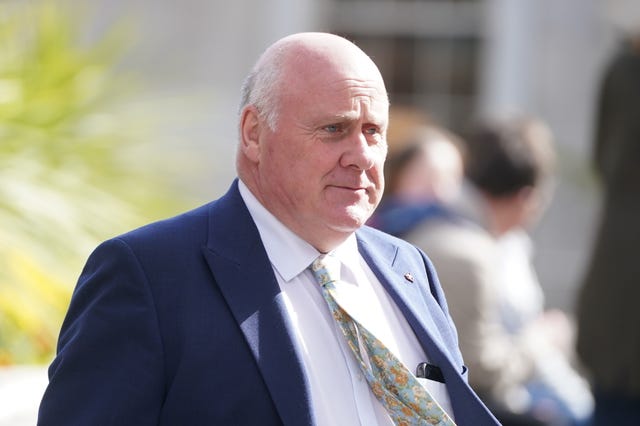 Noel Grealish walks along in the sunshine