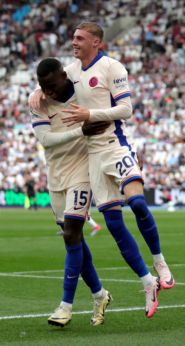 Nicholas Jakcson lifts a smiling Cole Palmer off the floor as they celebrate the third Chelsea goal.
