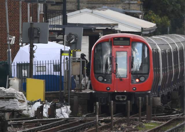 A forensic tent on the platform at Parsons Green station (Stefan Rousseau/PA)