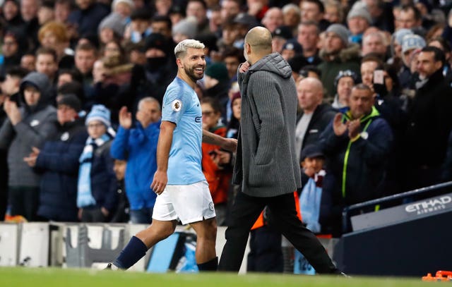 Manchester City’s Sergio Aguero shares a joke with manager Pep Guardiola