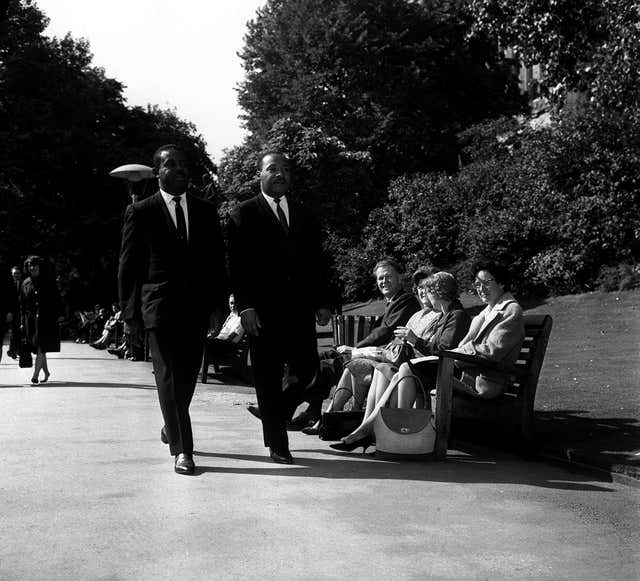 Martin Luther King walking in Embankment Gardens in London with the Rev Ralph Abernathy (PA)