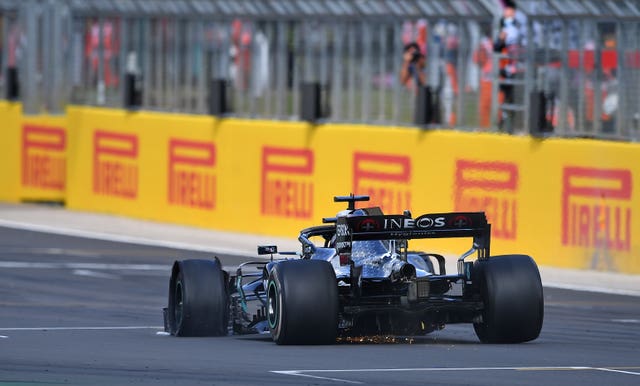 Lewis Hamilton crossed the line on three wheels following his puncture (PA Wire)
