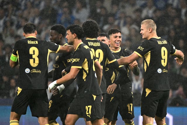 Manchester City’s Erling Haaland, right, celebrates his first goal with team-mates