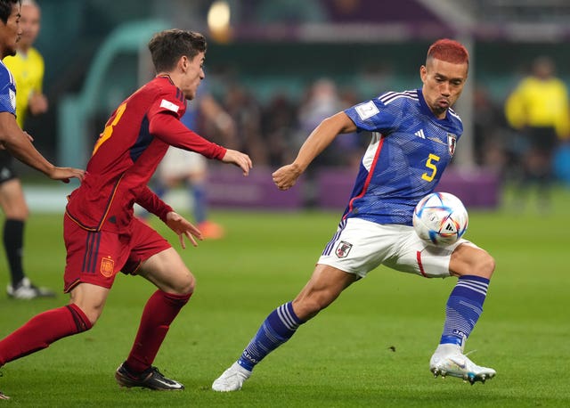 Yuto Nagatomo (right) in action for Japan in their win against Spain (Martin Rickett/PA).