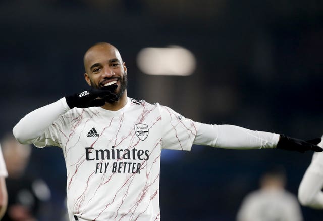 Lacazette celebrates his quick-fire goal from the bench