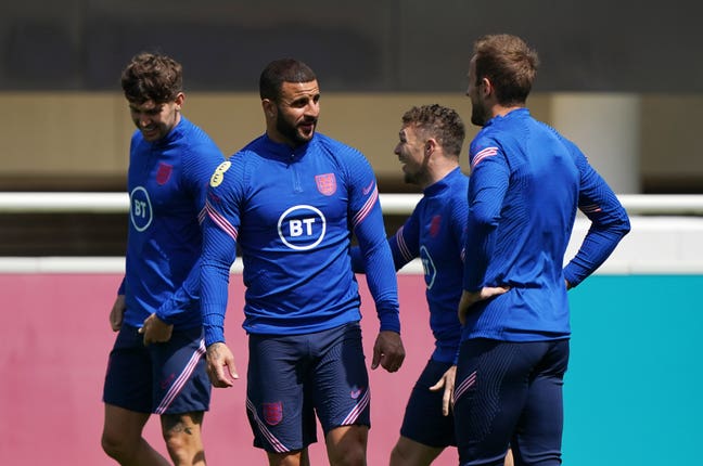 Kyle Walker speaks to Harry Kane during a training session at St George’s Park
