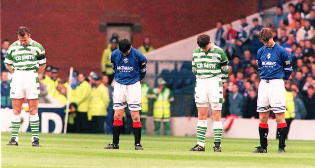 Rangers and Celtic players observed a one minute's silence before their game at Ibrox