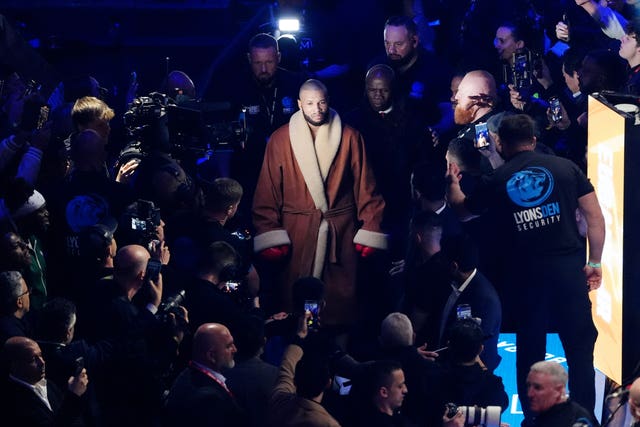Chris Eubank Jr and Chris Eubank Sr walk out ahead of the fight