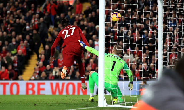 Divock Origi scores a dramatic winner for Liverpool after an error from Everton goalkeeper Jordan Pickford 