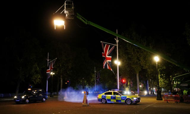 A police car is used for a chase sequence during the filming for the latest movie in the Fast and Furious franchise in The Mall, central London