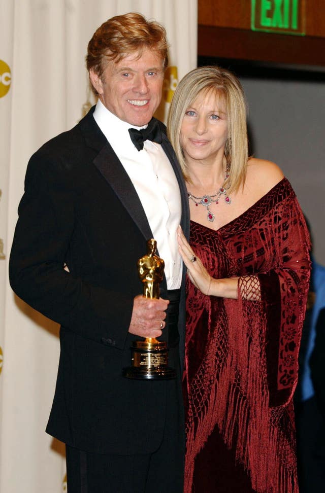Barbra Streisand and Robert Redford at an Oscars ceremony