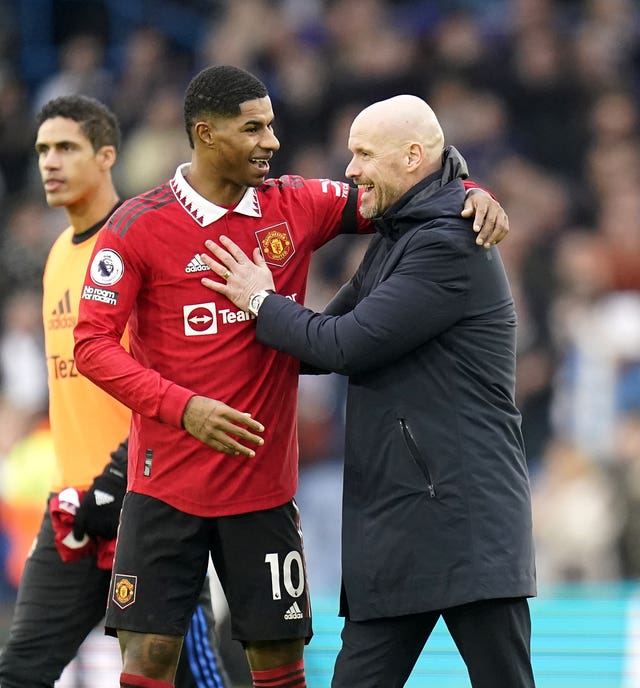 Marcus Rashford with Erik ten Hag, right