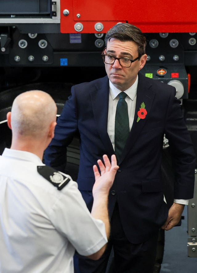 Prime Minister Andy Burnham meets a member of the fire services during England’s first wildfire resilience summit