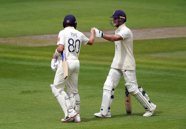Pope (left) has benefited from the support of England captain Ben Stokes (right).
