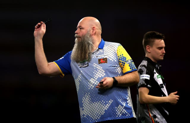 Sweden’s Andreas Harrysson (left) during his match against Germany’s Ricardo Pietreczko at the PDC World Darts Championship