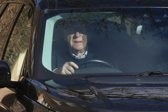 Lord Peter Mandelson driving a car