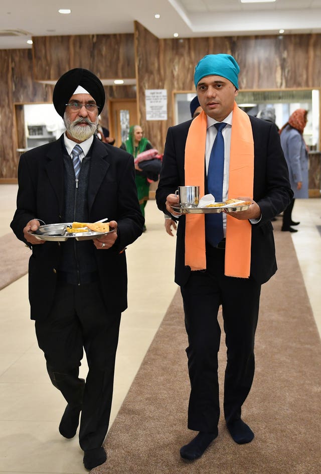 Chancellor Sajid Javid (right) during a visit to Nanaksar Gurdwara in Coventry