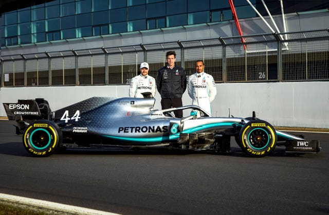 Toto Wolff alongside Mercedes drivers Valtteri Bottas and Lewis Hamilton