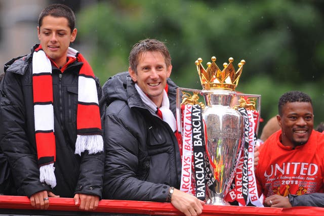 Patrice Evra, right, alongside Javier Hernandez, left, and Edwin Van Der Sar 