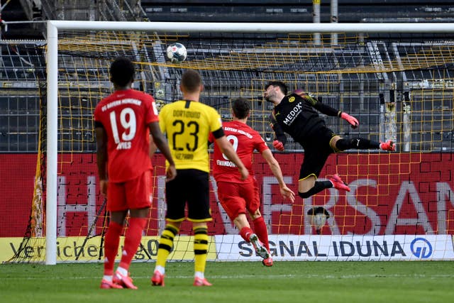 Dortmund goalkeeper Roman Burki is beaten by Joshua Kimmich