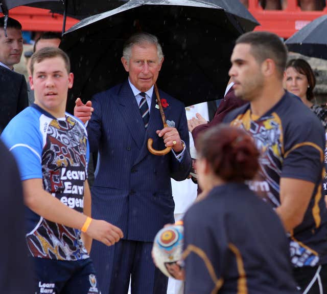 Charles watches rugby league players training on Bondi Beach in 2012