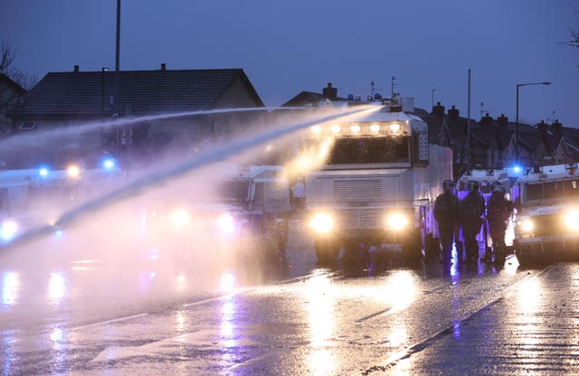 The PSNI use a water cannon on the Springfield road, during further unrest in Belfast