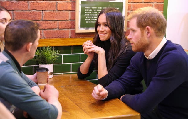 Prince Harry and Meghan Markle drop for a chat at the Social Bite cafe which donates all profits to social causes (Owen Humphreys/PA)