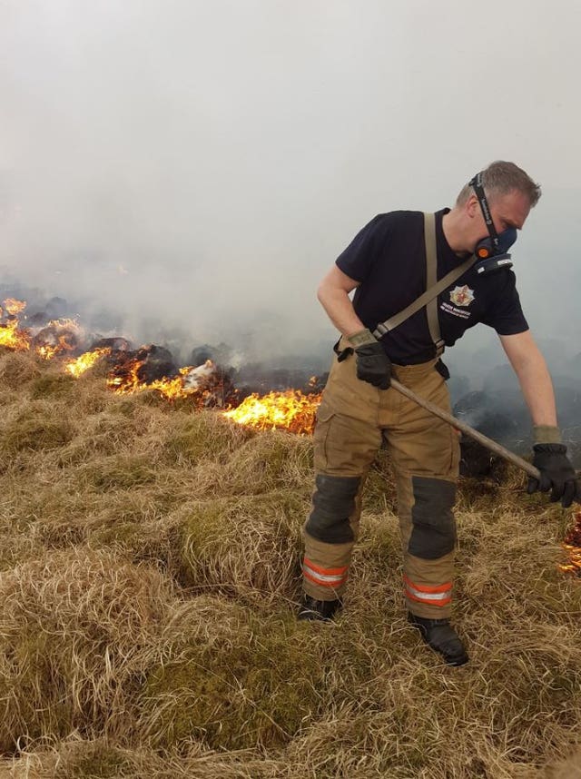 A firefighter at the scene in Lyme Park, near Manchester 