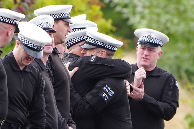 Police officers hugging
