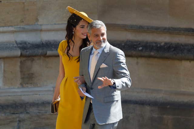 A-list celebrities including Amal Clooney and her husband George caused a stir among the early arrivals. (Odd Andersen/PA)