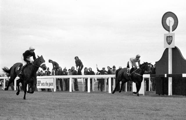 Red Rum (left) , ridden by Brian Fletcher, winning his first Grand National in 1973
