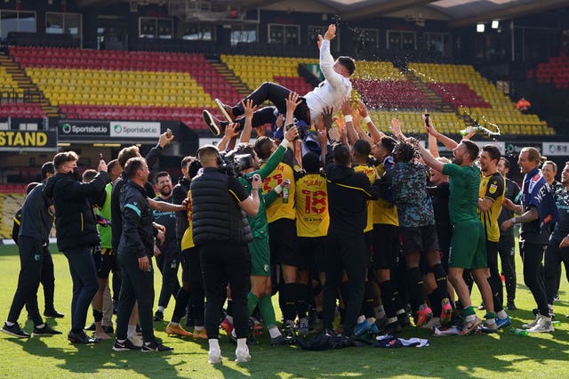 Watford manager Xisco is thrown in their air in celebration at the final whistle