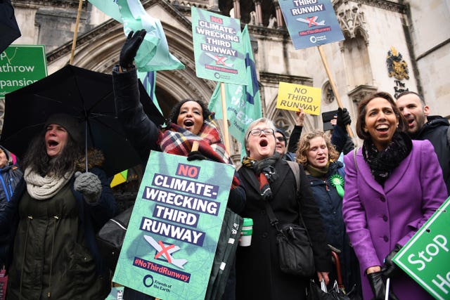 Campaigners cheer outside the Royal Courts of Justice after the ruling