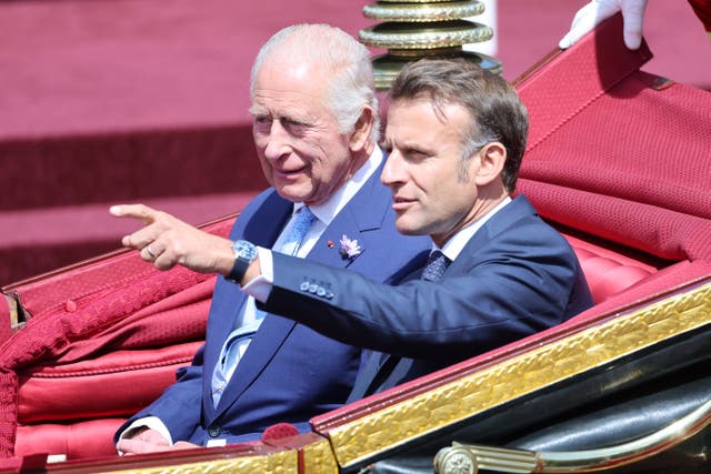 The King and Emmanuel Macron in a carriage