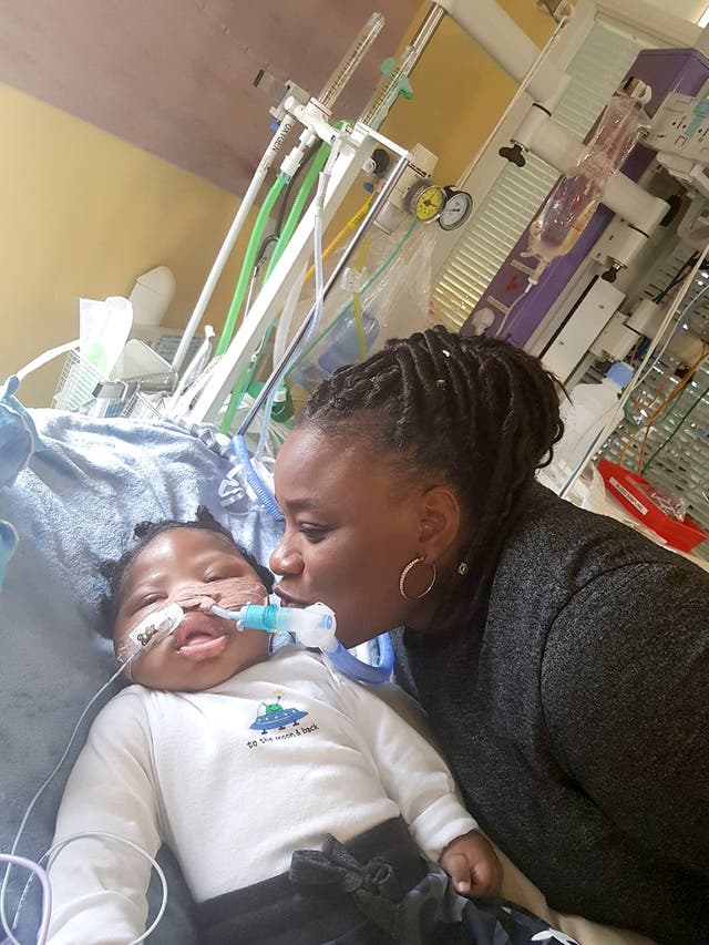 Isaiah Haastrup with his aunt Dahlia Thomas (Irwin Mitchell/PA)