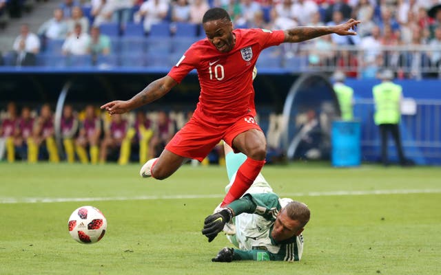 Sterling, left, is thwarted by Sweden goalkeeper Robin Olsen