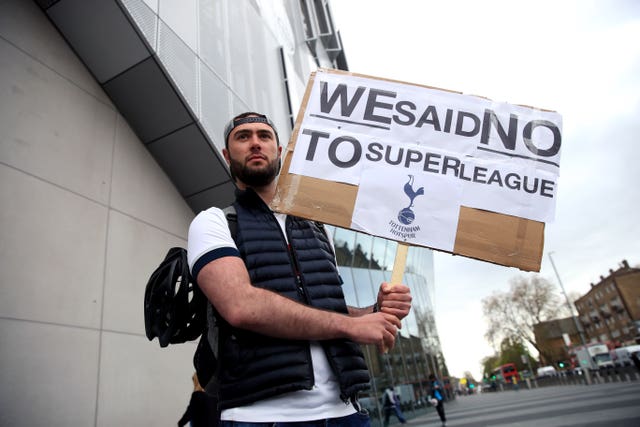 Tottenham Hotspur fans stage a protest against the European Super League outside the club's stadium 