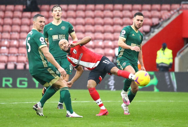 Nathan Redmond, centre, rounded off the scoring for Saints