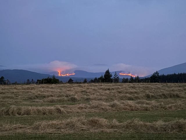 View of wildfire on hills in the distance