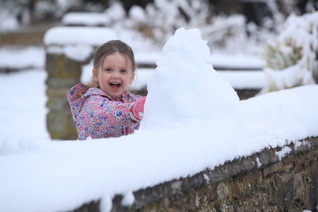 Three-year-old Molly Maybury enjoys the wintry conditions in Leyburn in the Yorkshire Dales