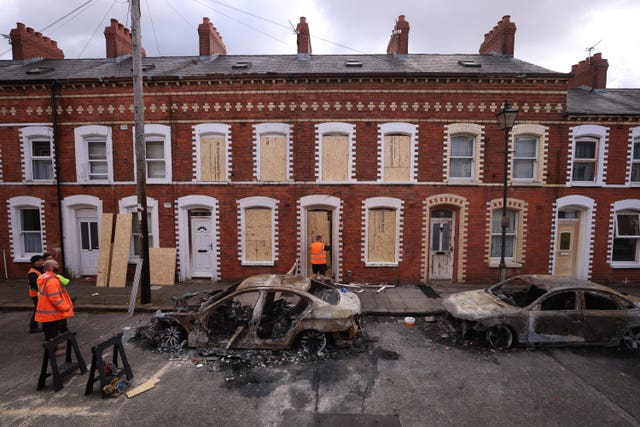 Burned out cars and boarded up houses on McMaster Street in east Belfast