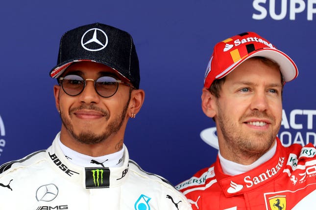 Vettel (right) believes Hamilton (left) deserves all the success he has enjoyed
