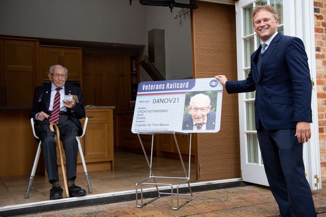 Transport Secretary Grant Shapps presents Captain Sir Tom Moore with the first veterans railcard