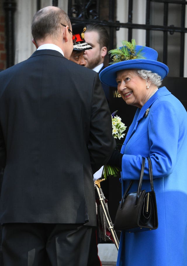 GCHQ director Jeremy Fleming talks to the Queen during a visit to Watergate House in London to mark its centenary