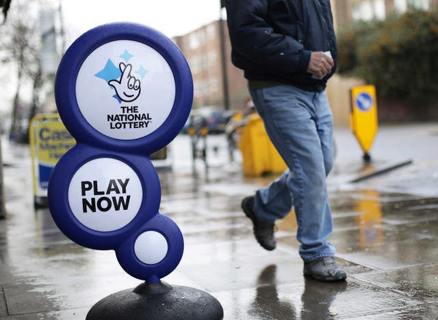 A National Lottery sign outside a newsagent
