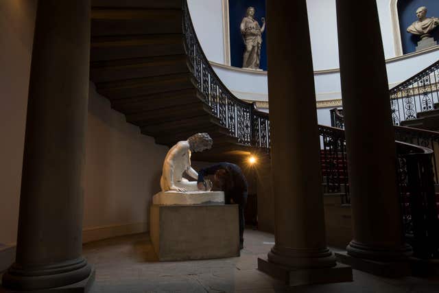 A statue being restored inside Wentworth Woodhouse (Aaron Chown/PA)